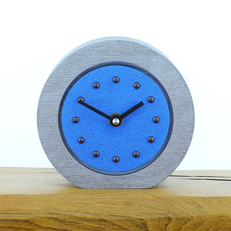 Round Light Blue Mantel Clock, Silver Frame, Antique Studs, Black Hands