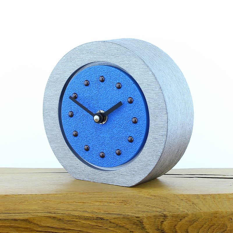 Round Light Blue Mantel Clock, Silver Frame, Antique Studs, Black Hands