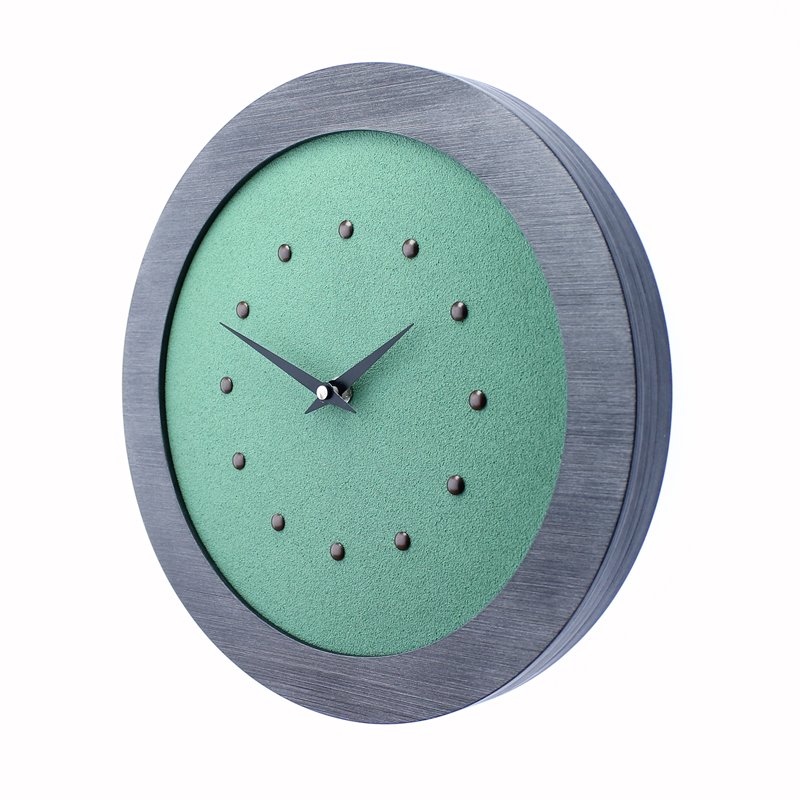 Light Green Wall Clock in Pewter Coloured Frame, Antique Studs and Black Hands.