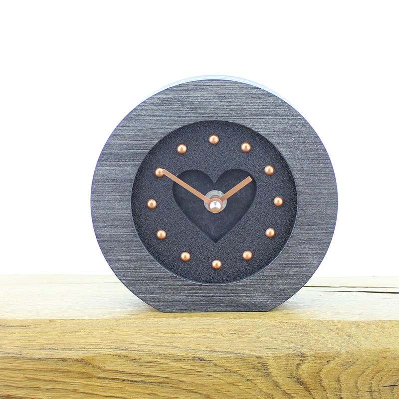 Round Pewter Colour Framed, Black Faced Mantel Clock, with Recessed Black Slate Effect Heart, Copper Studs and Hands