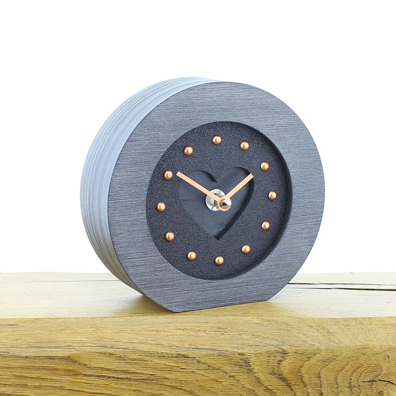 Round Pewter Colour Framed, Black Faced Mantel Clock, with Recessed Black Slate Effect Heart, Copper Studs and Hands