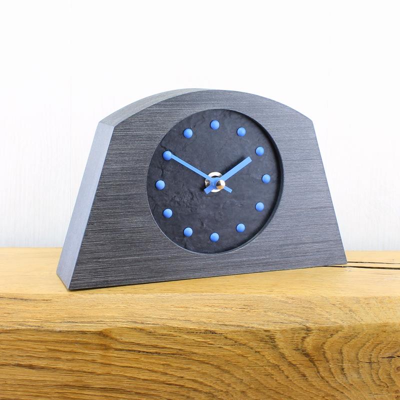 Slate Effect Mantel Clock in a Arched Pewter Coloured Frame with Light Blue Studs and Hands
