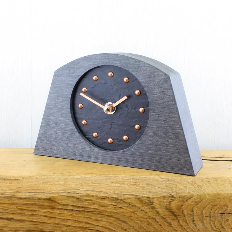 Slate Effect Mantel Clock in a Arch Shaped Pewter Coloured Frame with Copper Studs and Silver Hands