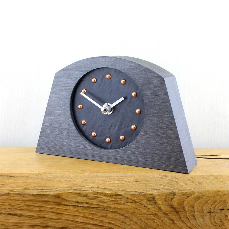 Slate Effect Mantel Clock in a Arch Shaped Pewter Coloured Frame with Copper Studs and Silver Hands