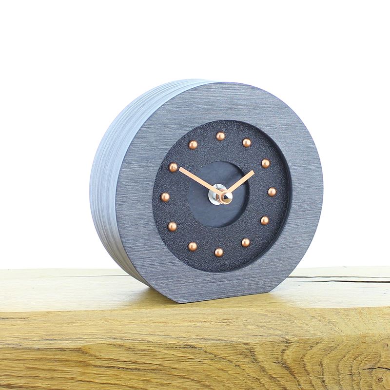 Round Pewter Colour Framed, Black Faced Mantel Clock, with Recessed Black Slate Effect Center, Copper Studs and Hands