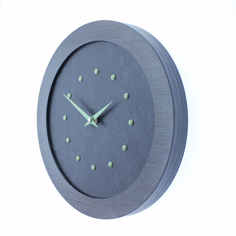 A Stylish Slate Effect Wall Clock in a Pewter Coloured Frame with Light Green Studs and Hands
